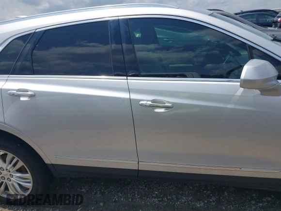 2018 Cadillac XT5 FWD with VIN 1GYKNARS4JZ142654, listed as a IAAI auction lot 42275794 with 112,790 mi miles and . Bid and sale history available at DreamBid. Image 13.