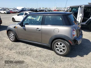2013 MINI Hardtop with VIN WMWSU3C57DT678736, listed as a Copart auction lot 52586285 with 64,563 mi miles and Salvage Title. Bid and sale history available at DreamBid. Image 2.