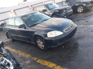 1999 Honda Civic EX with VIN 1HGEJ8644XL037266, listed as a IAAI auction lot 41254910 with 171,509 mi miles. Bid and sale history available at carsss.com. Image 1.