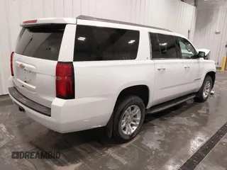 2020 Chevrolet Suburban LT with VIN 1GNSKHKC5LR108971, listed as a IAAI auction lot 41651417 with 90,674 mi miles. Bid and sale history available at carsss.com. Image 4.