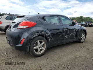 2013 Hyundai Veloster w/Gray Int z VIN KMHTC6AD9DU110094, wystawiony jako Copart lot #64660645 z przebiegiem 149 746 mil mil oraz Szkoda całkowita • Salvage title. Historia ofert i sprzedaży dostępna na DreamBid. Obrazek 3.