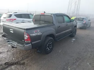 2015 Toyota Tacoma with VIN 3TMLU4EN7FM201302, listed as a IAAI auction lot 41666606 with 200,504 mi miles and . Bid and sale history available at DreamBid. Image 4.