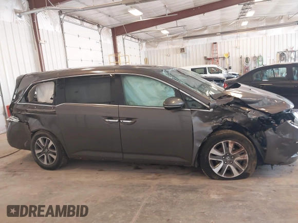 2014 Honda Odyssey Touring with VIN 5FNRL5H99EB105059, listed as a IAAI auction lot 42457672 with 240,581 mi miles and . Bid and sale history available at DreamBid. Image 13.