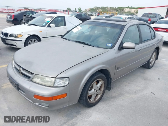 1999 Nissan Maxima GXE with VIN JN1CA21D6XT223369, listed as a IAAI auction lot 42141361 with 210,781 mi miles and . Bid and sale history available at DreamBid. Image 2.
