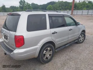 2003 Honda Pilot EX with VIN 2HKYF18523H543302, listed as a IAAI auction lot 42052364 with 331,473 mi miles. Bid and sale history available at carsss.com. Image 4.