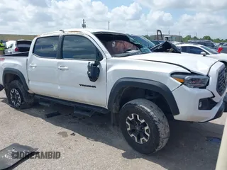 2023 Toyota Tacoma SR with VIN 3TMCZ5AN2PM616378, listed as a IAAI auction lot 42485371 with 33,380 mi miles and . Bid and sale history available at DreamBid. Image 1.