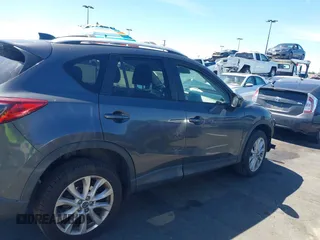 2014 Mazda CX-5 Grand Touring with VIN JM3KE4DY8E0391317, listed as a IAAI auction lot 41871641 with 77,048 mi miles. Bid and sale history available at carsss.com. Image 13.