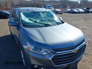 2021 Chevrolet Traverse LT Cloth with VIN 1GNEVGKW2MJ146411, listed as a IAAI auction lot 41694651 with 57,673 mi miles. Bid and sale history available at carsss.com. Image 6.