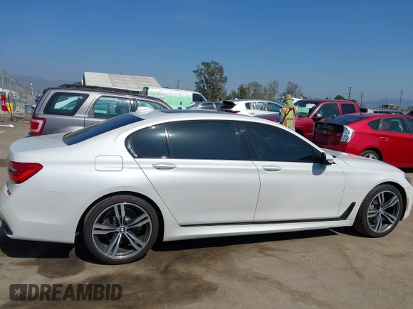 2019 BMW 7 Series 750i with VIN WBA7F0C5XKGM25771, listed as a IAAI auction lot 42167614 with 73,692 mi miles. Bid and sale history available at carsss.com. Image 13.