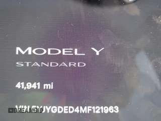 2021 Tesla Model Y Standard Range z VIN 5YJYGDED4MF121963, wystawiony jako IAAI lot #41490477 z przebiegiem 41 941 mil mil oraz . Historia ofert i sprzedaży dostępna na DreamBid. Obrazek 7.