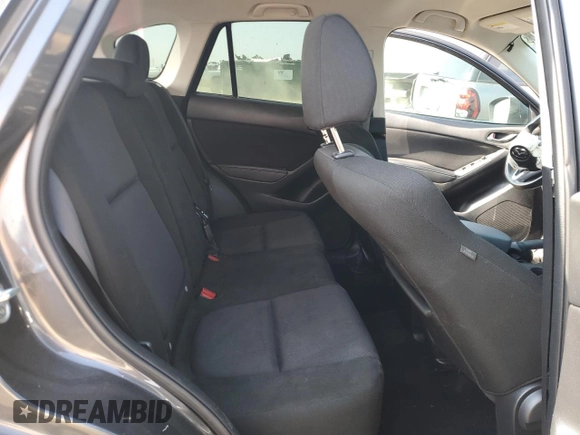 2014 Mazda CX-5 Sport z VIN JM3KE4BE1E0359446, wystawiony jako Copart lot #54562545 z przebiegiem 128 150 mil mil oraz Szkoda całkowita • Salvage title. Historia ofert i sprzedaży dostępna na DreamBid. Obrazek 11.