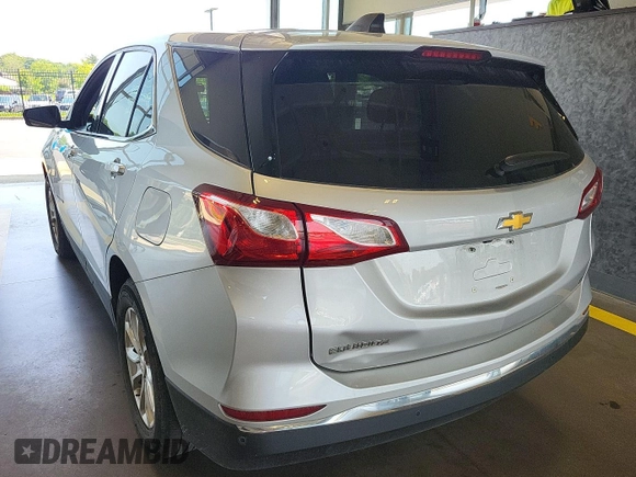 2020 Chevrolet Equinox LT with VIN 2GNAXJEV0L6236404, listed as a IAAI auction lot 42619695 with 77,124 mi miles and . Bid and sale history available at DreamBid. Image 16.