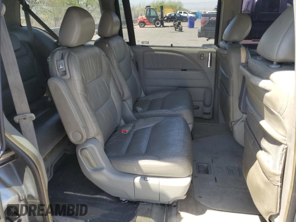 2005 Honda Odyssey Touring z VIN 5FNRL38805B131416, wystawiony jako Copart lot #59157395 z przebiegiem 263 087 mil mil oraz Szkoda całkowita • Salvage title. Historia ofert i sprzedaży dostępna na DreamBid. Obrazek 11.