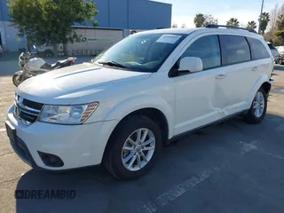 2015 Dodge Journey SXT with VIN 3C4PDCBG8FT673824, listed as a IAAI auction lot 41603661 with 169,939 mi miles and . Bid and sale history available at DreamBid. Image 2.