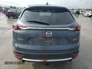 2021 Mazda CX-9 Grand Touring z VIN JM3TCADYXM0519757, wystawiony jako Copart lot #86665134 z przebiegiem 51 217 mil mil oraz Szkoda całkowita • Salvage title. Historia ofert i sprzedaży dostępna na DreamBid. Obrazek 6.
