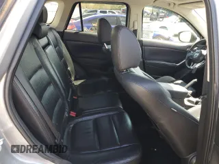 2014 Mazda CX-5 Grand Touring with VIN JM3KE4DY4E0305212, listed as a Copart auction lot 53145305 with 233,061 mi miles and Salvage Title. Bid and sale history available at carsss.com. Image 11.