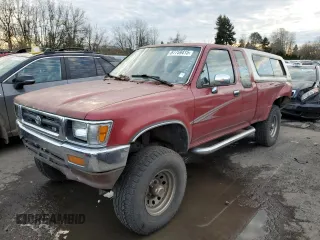 1994 Toyota Pickup DX with VIN 4TAVN13D1RZ229710, listed as a Copart auction lot 87759415 with 338,915 mi miles and Salvage title. Bid and sale history available at DreamBid. Image 1.