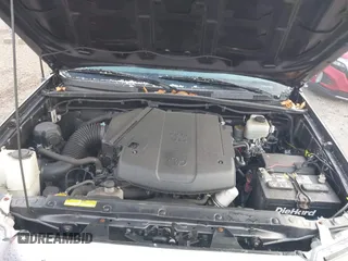 2015 Toyota Tacoma with VIN 3TMLU4EN7FM201302, listed as a IAAI auction lot 41666606 with 200,504 mi miles and . Bid and sale history available at DreamBid. Image 10.