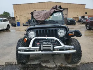 2002 Jeep Wrangler Sahara with VIN 1J4FA59SX2P747327, listed as a Copart auction lot 59515455 with 79,964 mi miles and Salvage title. Bid and sale history available at DreamBid. Image 5.