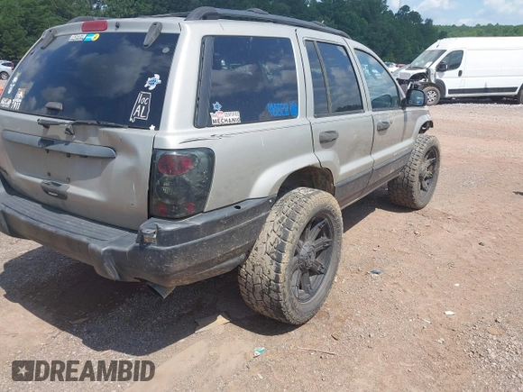 2004 Jeep Grand Cherokee Laredo with VIN 1J4GW48S34C354006, listed as a IAAI auction lot 42599812 with 258,004 mi miles and . Bid and sale history available at DreamBid. Image 4.