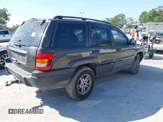 2004 Jeep Grand Cherokee Laredo with VIN 1J4GW48S74C401022, listed as a IAAI auction lot 41982319 with 170,607 mi miles. Bid and sale history available at carsss.com. Image 4.
