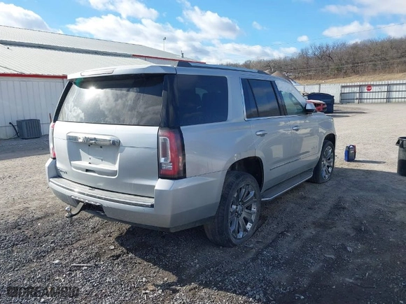 2016 GMC Yukon Denali with VIN 1GKS2CKJ1GR291872, listed as a IAAI auction lot 41169434 with 137,009 mi miles. Bid and sale history available at carsss.com. Image 4.