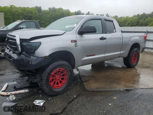 2010 Toyota Tundra with VIN 5TFUY5F15AX123633, listed as a Copart auction lot 57053995 with 85,716 mi miles and Salvage title. Bid and sale history available at DreamBid. Image 1.