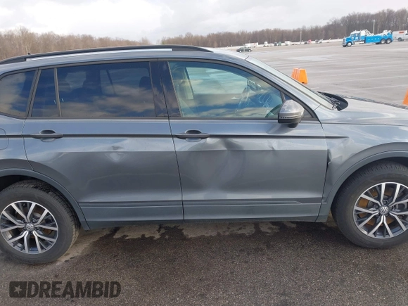 2021 Volkswagen Tiguan S with VIN 3VV1B7AX8MM016874, listed as a IAAI auction lot 41633090 with 76,857 mi miles and . Bid and sale history available at DreamBid. Image 13.