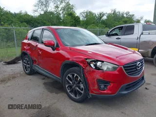 2016 Mazda CX-5 Grand Touring z VIN JM3KE2DY8G0822665, wystawiony jako IAAI lot #42061119 z przebiegiem 179 172 mil mil oraz . Historia ofert i sprzedaży dostępna na DreamBid. Obrazek 1.