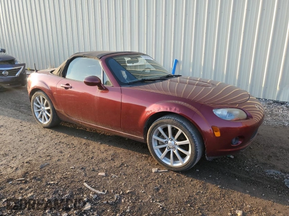 2007 Mazda MX-5 Miata Sport z VIN JM1NC25F970124896, wystawiony jako Copart lot #83624394 z przebiegiem 62 735 mil mil oraz Szkoda całkowita • Salvage title. Historia ofert i sprzedaży dostępna na DreamBid. Obrazek 4.