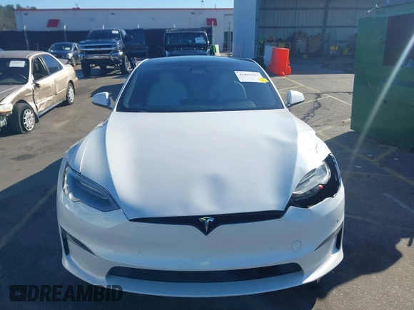 2021 Tesla Model S Long Range with VIN 5YJSA1E56MF453711, listed as a IAAI auction lot 41467603 with 115,634 mi miles and . Bid and sale history available at DreamBid. Image 12.