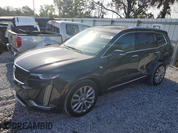 2021 Cadillac XT6 Premium Luxury with VIN 1GYKPCRS1MZ199288, listed as a Copart auction lot 54264995 with 51,432 mi miles and Salvage Title. Bid and sale history available at carsss.com. Image 1.