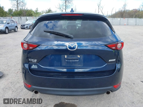 2019 Mazda CX-5 Grand Touring with VIN JM3KFBDM2K0603400, listed as a IAAI auction lot 42051135 with 59,448 mi miles and . Bid and sale history available at DreamBid. Image 16.