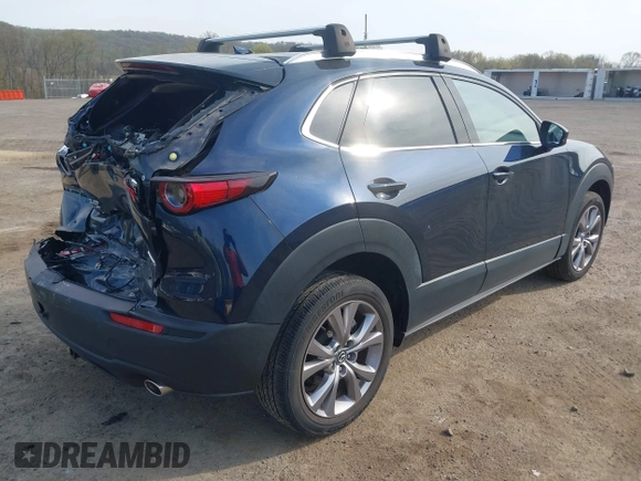 2021 Mazda CX-30 Premium with VIN 3MVDMBDM4MM238367, listed as a IAAI auction lot 42124335 with 31,120 mi miles and . Bid and sale history available at DreamBid. Image 4.