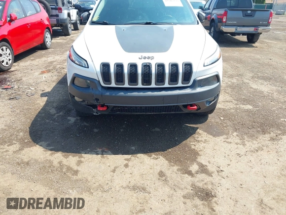 2014 Jeep Cherokee Trailhawk z VIN 1C4PJMBS0EW188976, wystawiony jako IAAI lot #42587233 z przebiegiem 191 670 mil mil oraz . Historia ofert i sprzedaży dostępna na DreamBid. Obrazek 6.