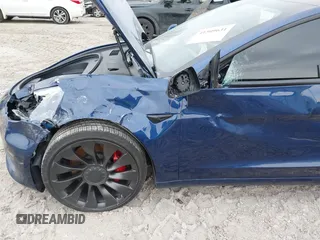 2021 Tesla Model 3 Performance with VIN 5YJ3E1EC6MF996743, listed as a IAAI auction lot 41509631 with 41,599 mi miles and . Bid and sale history available at DreamBid. Image 6.