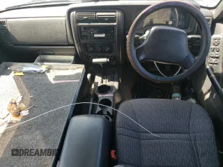2000 Jeep Cherokee with VIN 1J4FN28S6YL210944, listed as a Copart auction lot 65163475 with 147,609 mi miles and Salvage title. Bid and sale history available at DreamBid. Image 8.