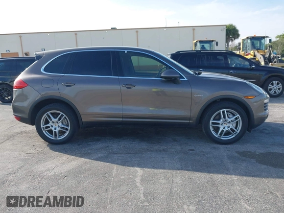 2011 Porsche Cayenne S Hybrid with VIN WP1AE2A29BLA94414, listed as a IAAI auction lot 41644386 with 76,095 mi miles. Bid and sale history available at carsss.com. Image 13.