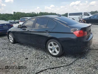 2013 BMW 3 Series 328i with VIN WBA3A5C57DF602652, listed as a Copart auction lot 60874345 with 147,214 mi miles and Salvage title. Bid and sale history available at DreamBid. Image 2.
