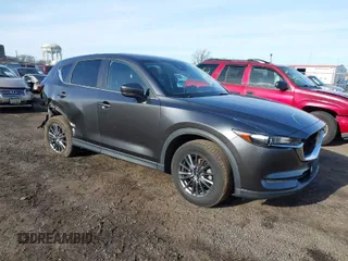 2021 Mazda CX-5 Touring with VIN JM3KFBCM8M0310623, listed as a IAAI auction lot 41502055 with 49,173 mi miles. Bid and sale history available at carsss.com. Image 1.