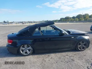 2011 BMW 1 Series 128i with VIN WBAUL7C54BVM80474, listed as a IAAI auction lot 42031032 with 76,617 mi miles and . Bid and sale history available at carsss.com. Image 13.