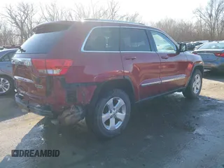 2012 Jeep Grand Cherokee Laredo with VIN 1C4RJFAG3CC163764, listed as a IAAI auction lot 41719137 with 198,827 mi miles. Bid and sale history available at carsss.com. Image 4.