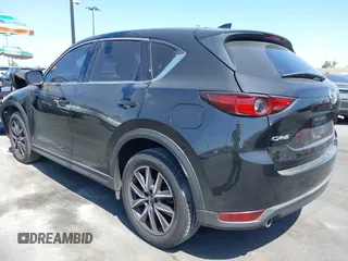 2018 Mazda CX-5 Grand Touring z VIN JM3KFADM7J0327272, wystawiony jako IAAI lot #42279536 z przebiegiem 97 478 mil mil oraz . Historia ofert i sprzedaży dostępna na DreamBid. Obrazek 3.