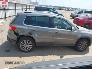 2011 Volkswagen Tiguan SEL w/Premium Navi with VIN WVGAV7AX0BW550059, listed as a IAAI auction lot 42071719 with 107,341 mi miles and . Bid and sale history available at DreamBid. Image 13.
