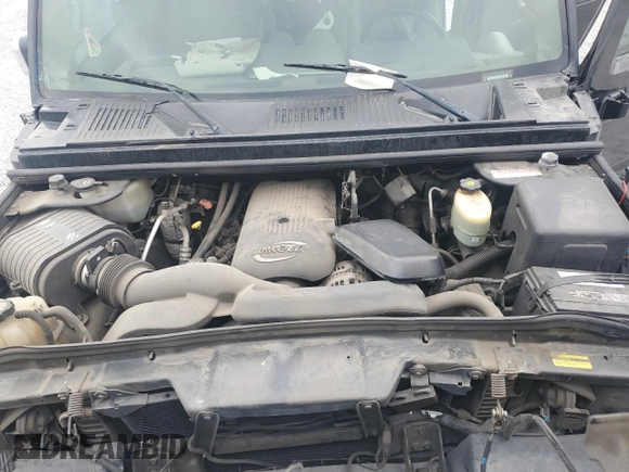 2004 Hummer H2 z VIN 5GRGN23U74H100175, wystawiony jako Copart lot #52642125 z przebiegiem 112 305 mil mil oraz Szkoda całkowita • Salvage title. Historia ofert i sprzedaży dostępna na DreamBid. Obrazek 13.
