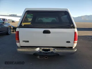2000 Ford F-150 with VIN 1FTRX17W8YKB11043, listed as a Copart auction lot 77390664 with 181,439 mi miles and Salvage Title. Bid and sale history available at DreamBid. Image 6.