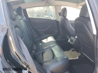 2021 Tesla Model 3 Standard Range Plus with VIN 5YJ3E1EA6MF067702, listed as a Copart auction lot 52048315 with 72,974 mi miles and Salvage Title. Bid and sale history available at carsss.com. Image 12.