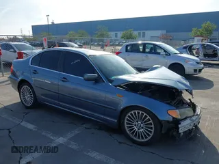 2003 BMW 3 Series 330i with VIN WBAEV53453KM03321, listed as a IAAI auction lot 41134433 with 186,586 mi miles. Bid and sale history available at carsss.com. Image 1.