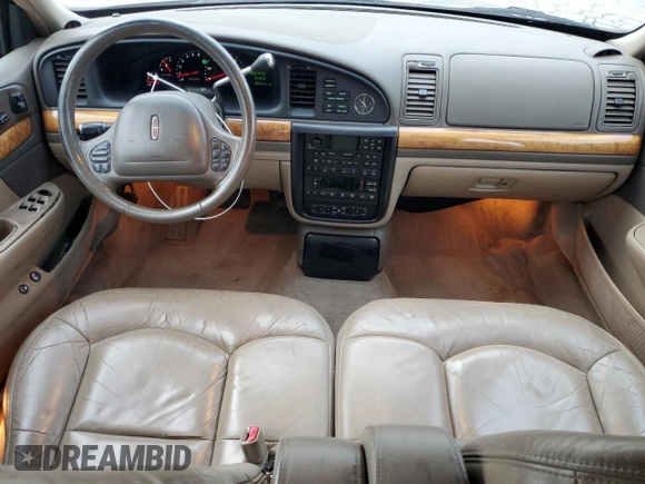 2001 Lincoln Continental z VIN 1LNHM97V41Y633841, wystawiony jako Copart lot #86695664 z przebiegiem 166 931 mil mil oraz Szkoda całkowita • Salvage title. Historia ofert i sprzedaży dostępna na DreamBid. Obrazek 8.