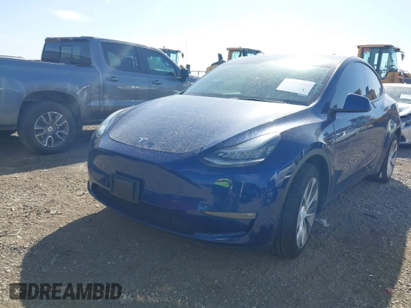2021 Tesla Model Y Standard Range z VIN 5YJYGDED6MF107711, wystawiony jako IAAI lot #41794384 z przebiegiem 86 934 mil mil oraz . Historia ofert i sprzedaży dostępna na DreamBid. Obrazek 2.